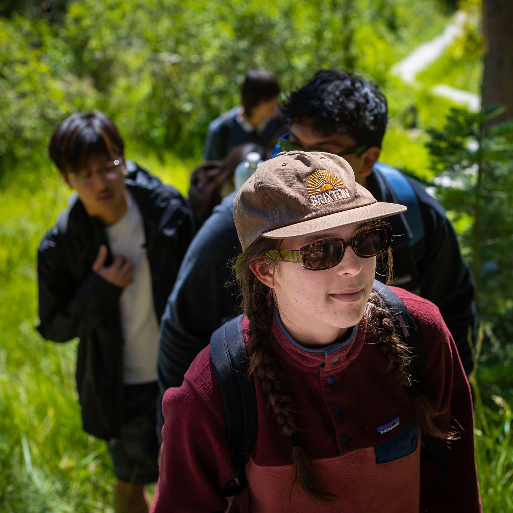 Liv Valinksy leading students on a hike