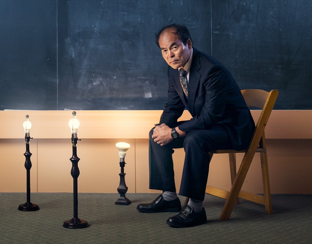 shuji sitting on chair with LED lights around him