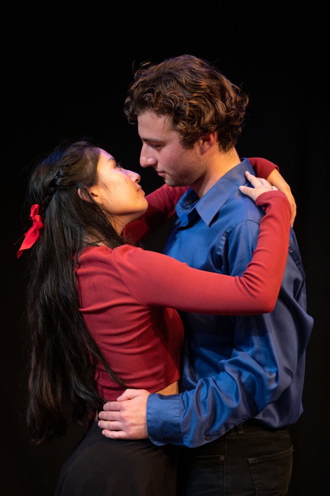 woman in red embracing man in blue