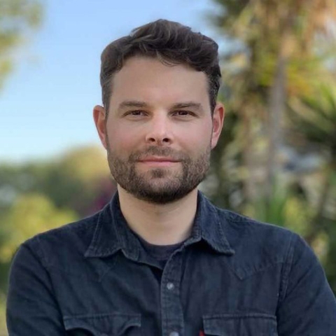 Ron Keiflin wears a dark collared shirt outside