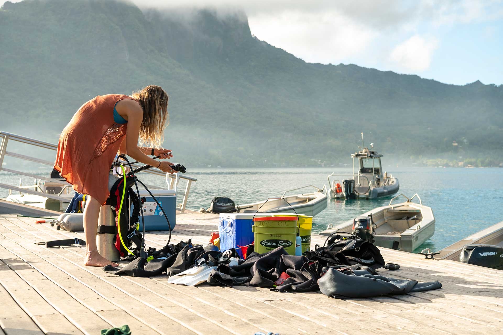Jacey Van Wert readies the dive equipment that will be used during a morning research expedition.