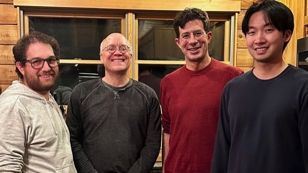 David Tadres, Jeff Moehlis, Matthieu Louis and Philip Wong standing together