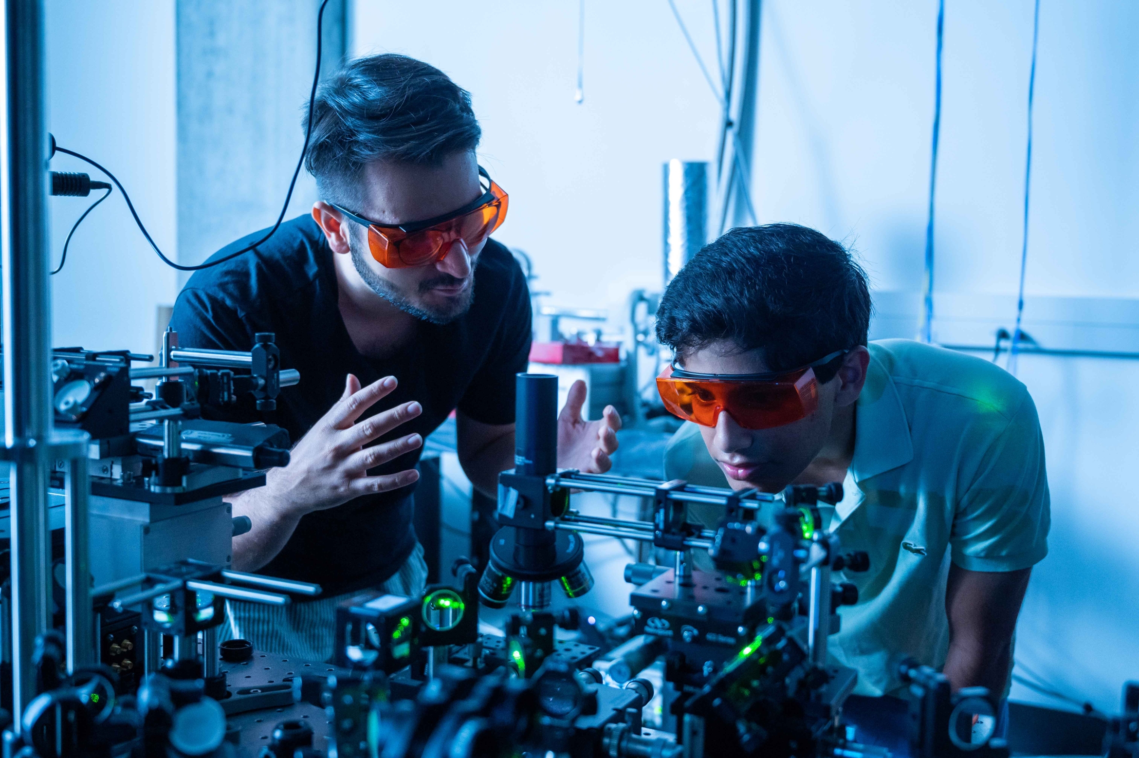 Kamyar Parto works in the Quantum Photonics Lab with Arjun Choudhri, a high school student he mentored last summer