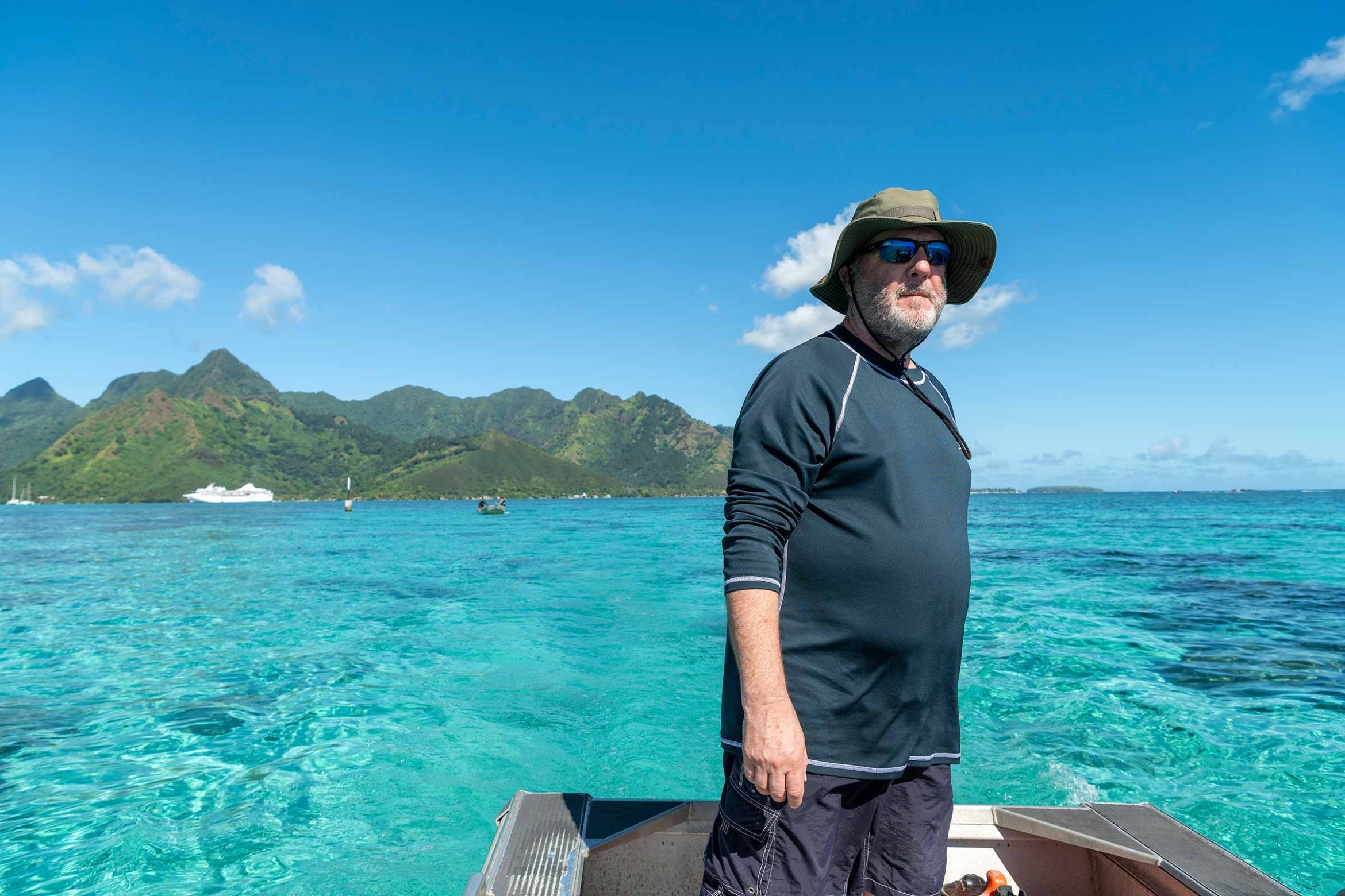 Andy Brooks standing while driving boat