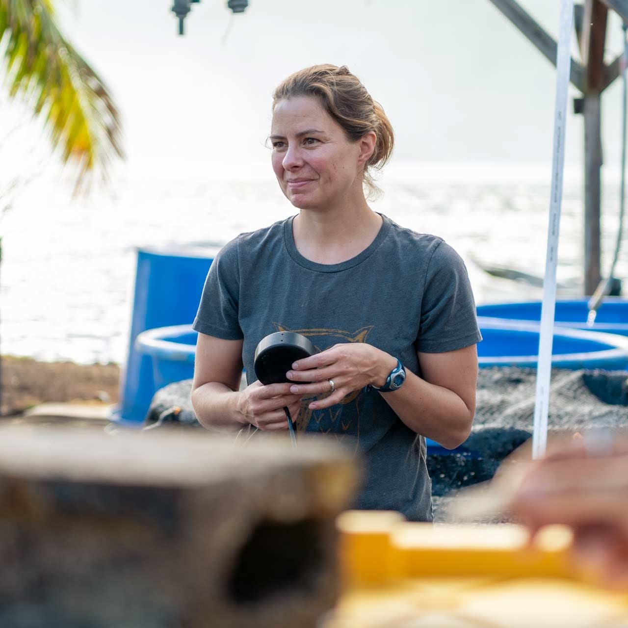 Erika Eliason holding a research instrument