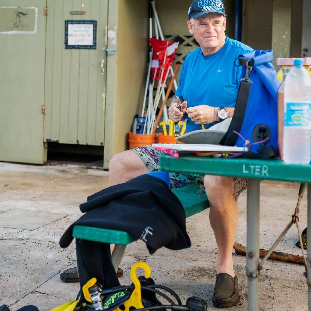 Hunter Lenihan preparing diving equipment