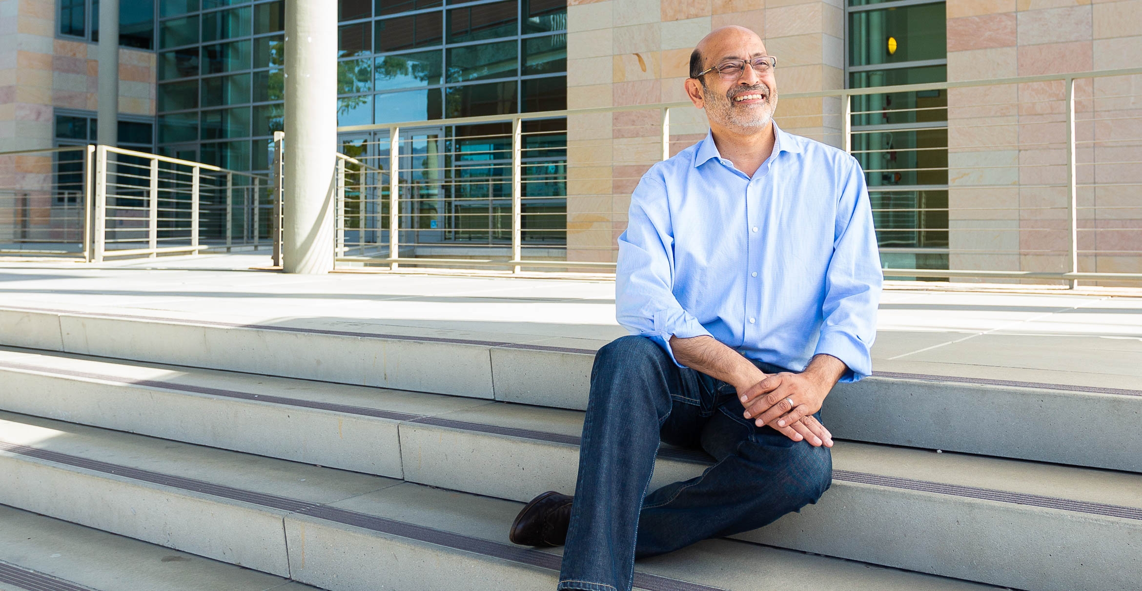 Professor Umesh Mishra sitting on stairs