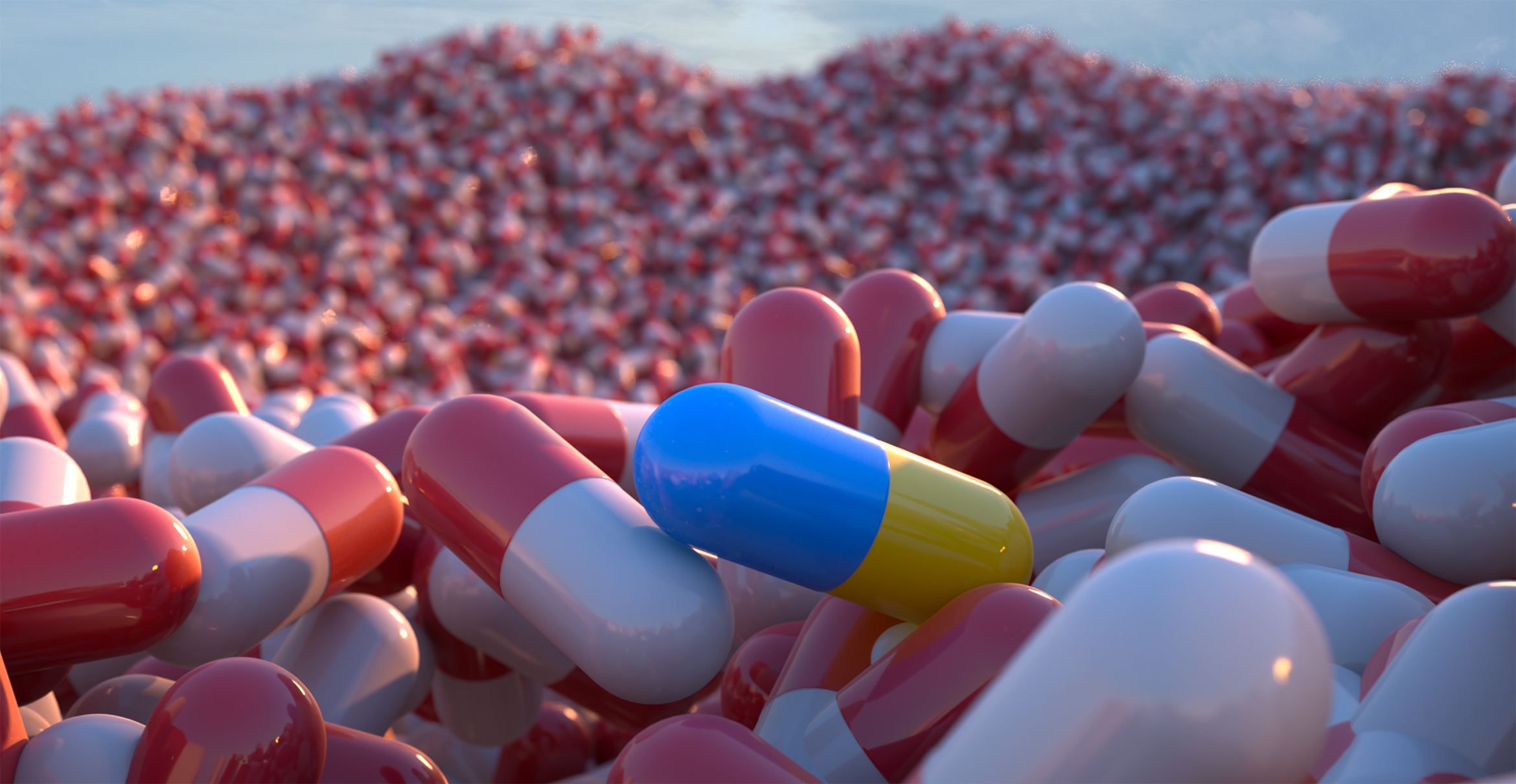 A mountain made of multicolored pill capsules