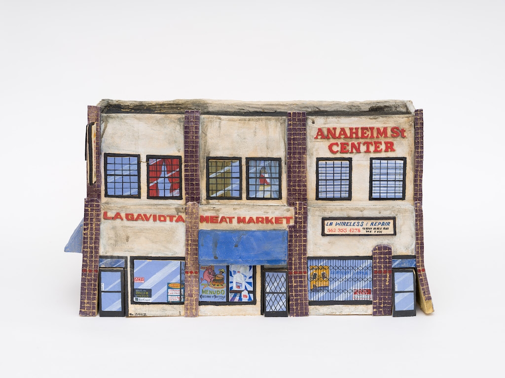 Ceramic reproduction of a meat market store front called La Gaviota.
