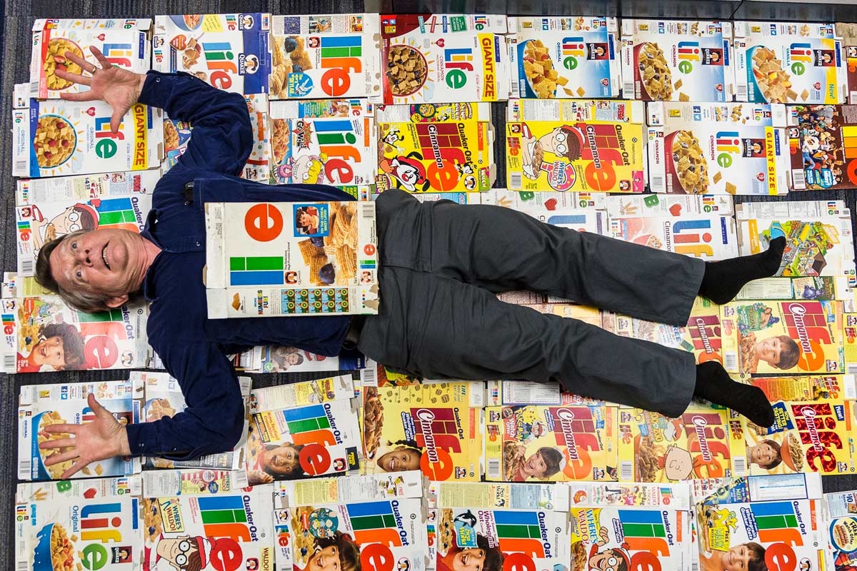 Theater professor William Davies King posed with his collection of Life cereal boxes