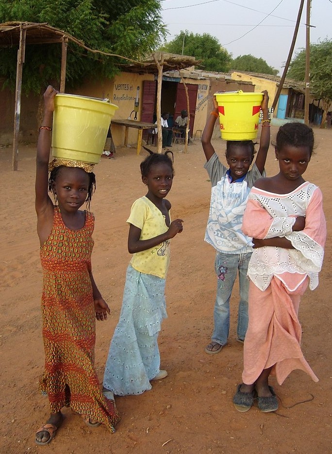 young girls gathering water in rural north senegal