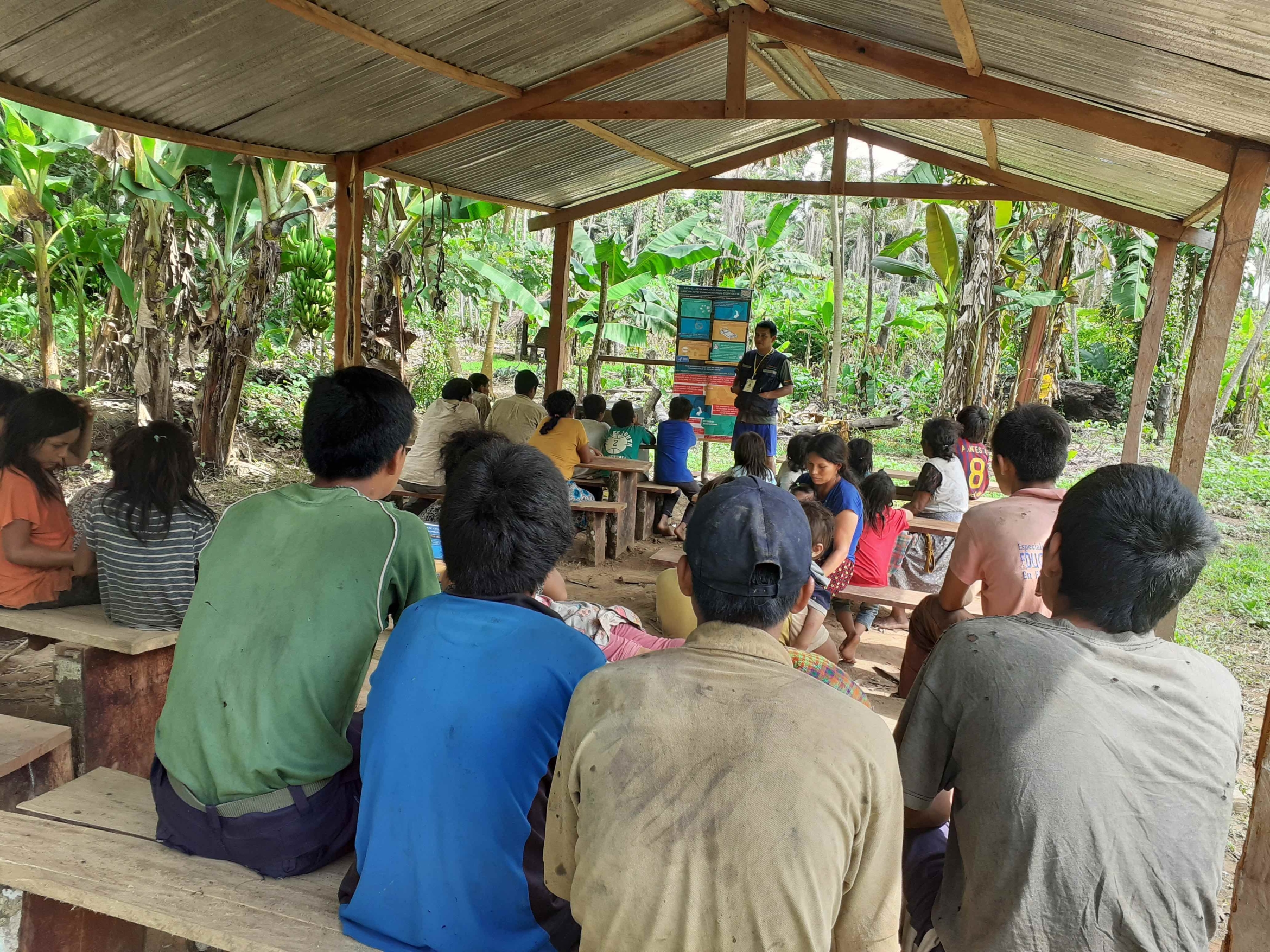Bolivian tribe receiving health education regarding COVID-19