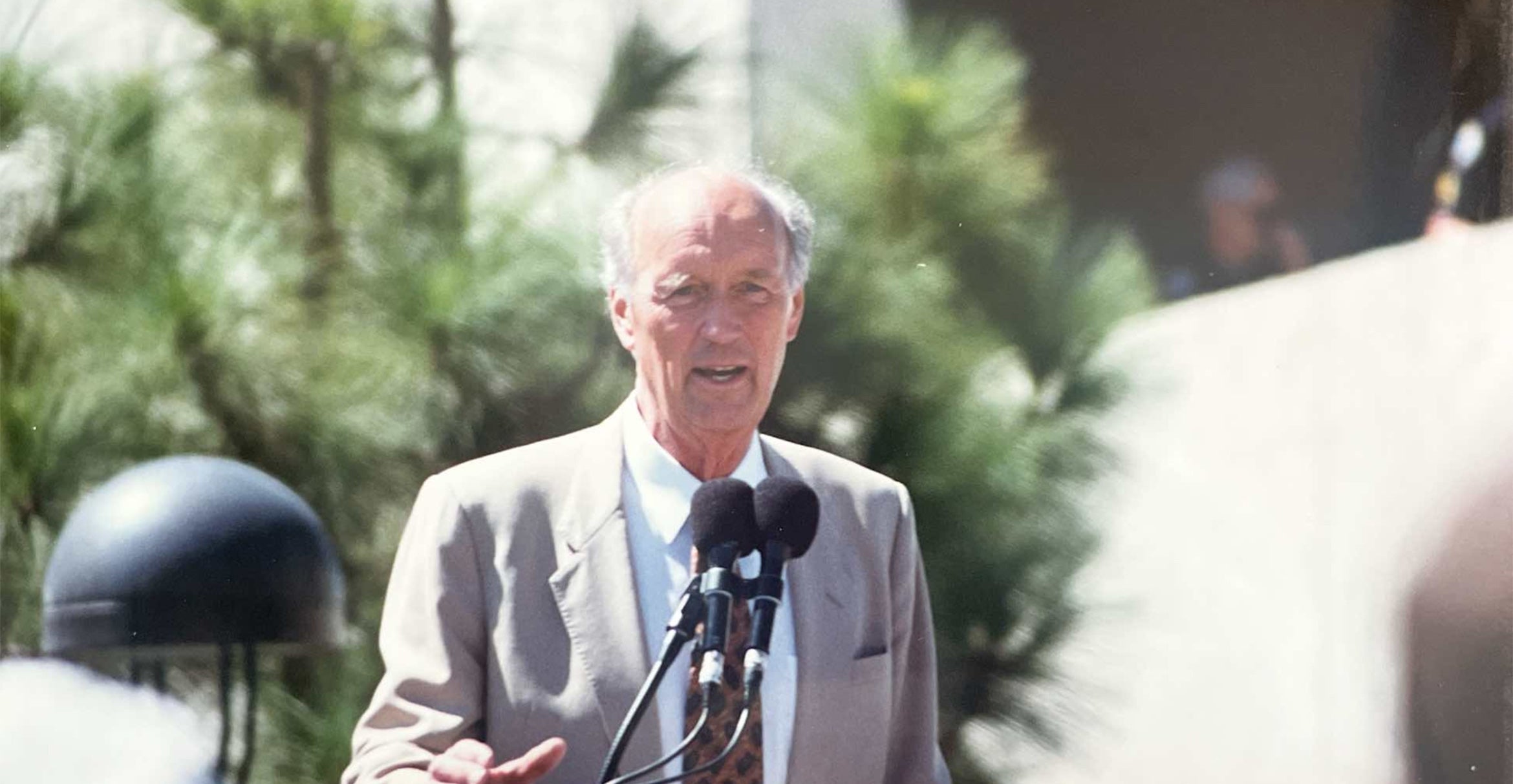 Walter Capps speaking from a podium