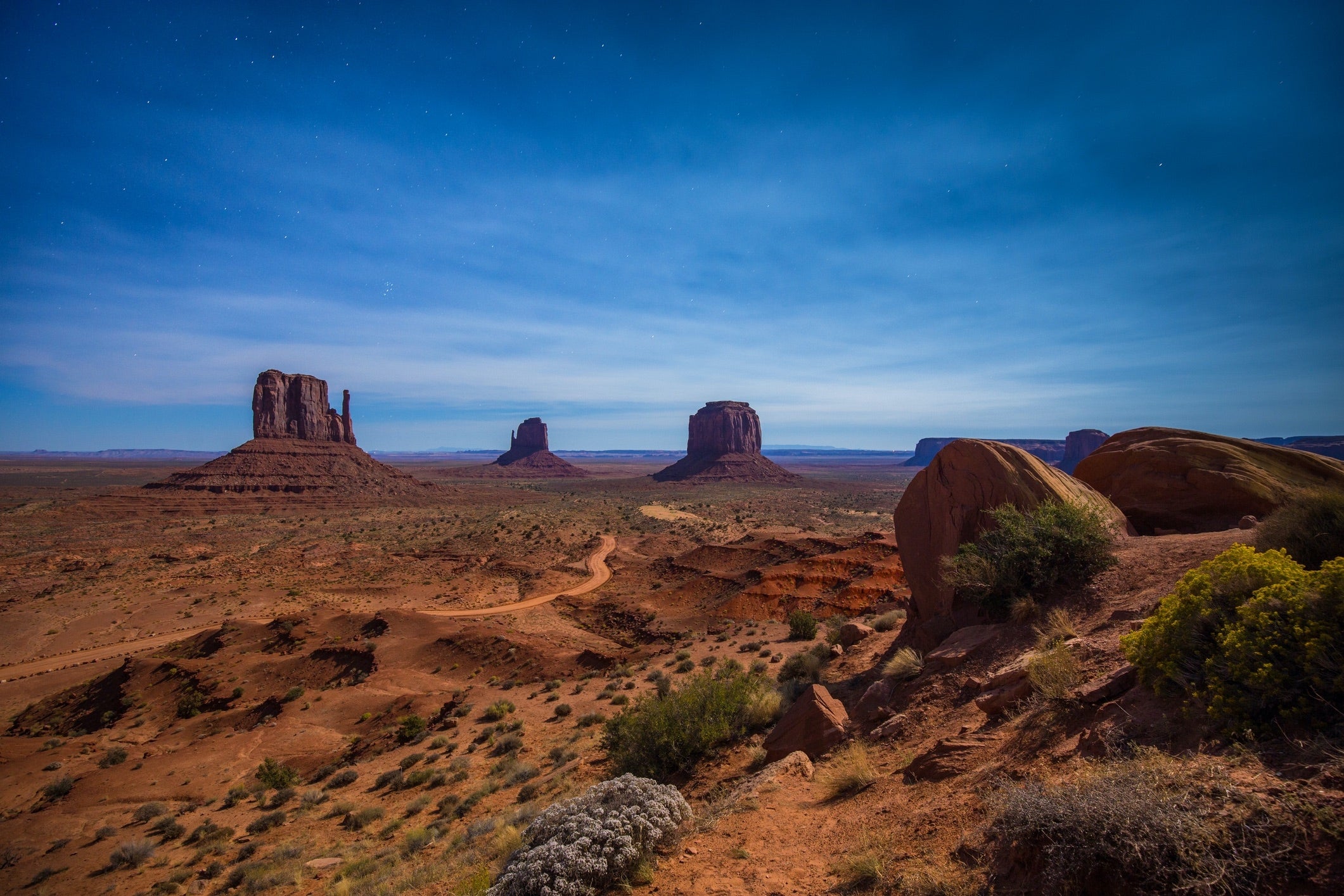 early evening stars over a desert landscape