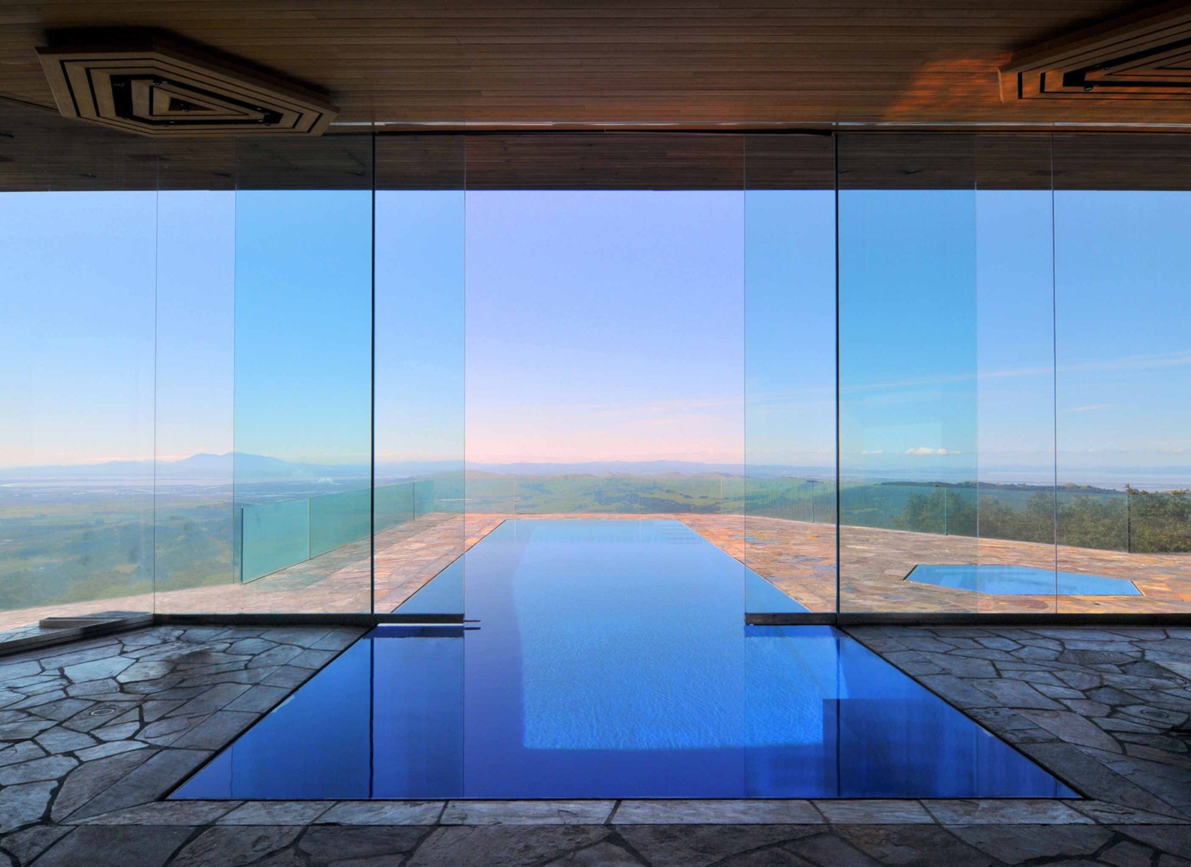 blue infinity pool rectangular shape overlooking the hills