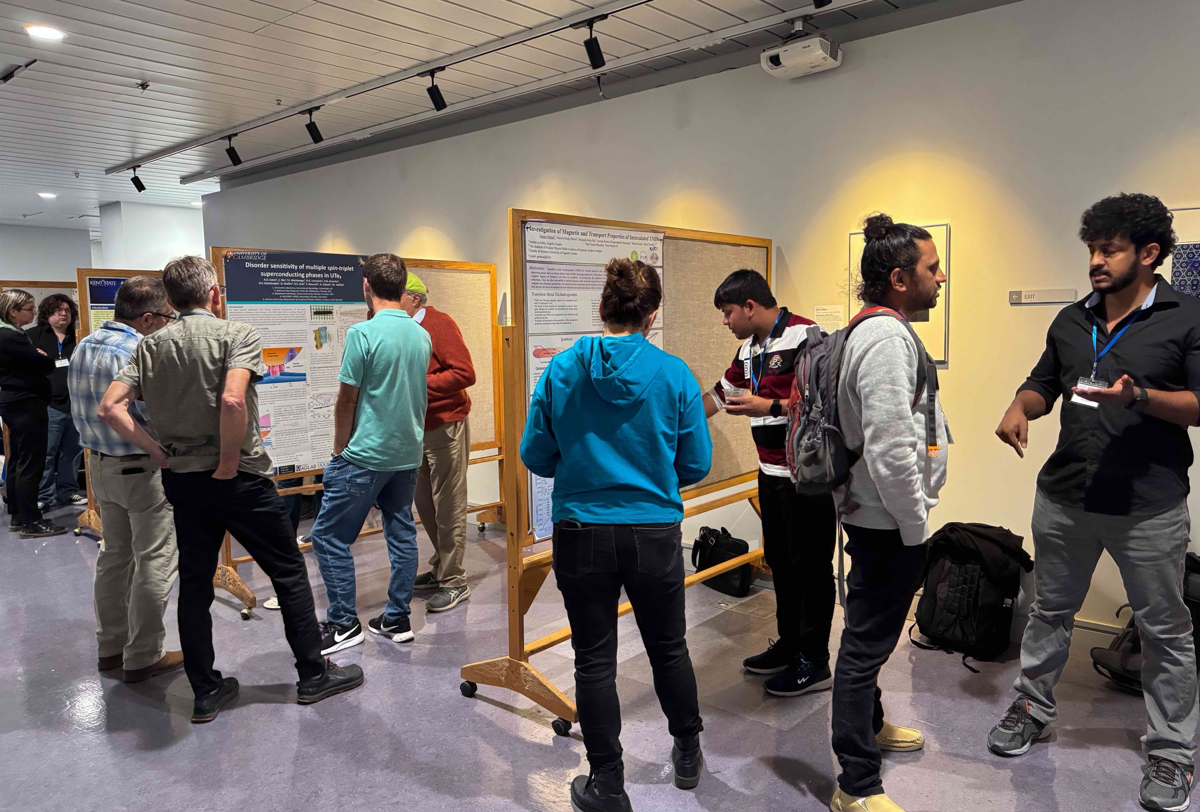 scientists discussing projects at a poster session