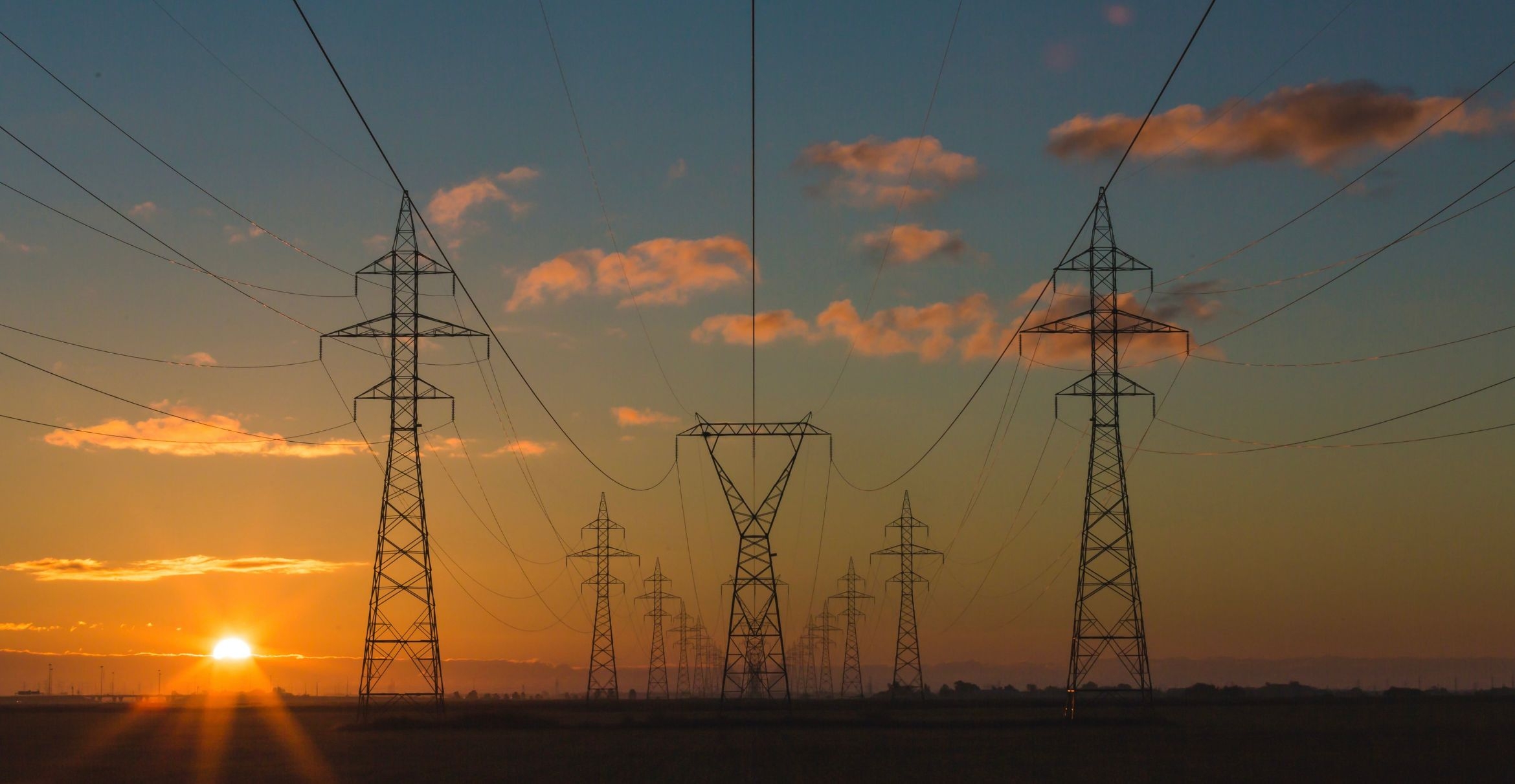 Power pylons at sunset.