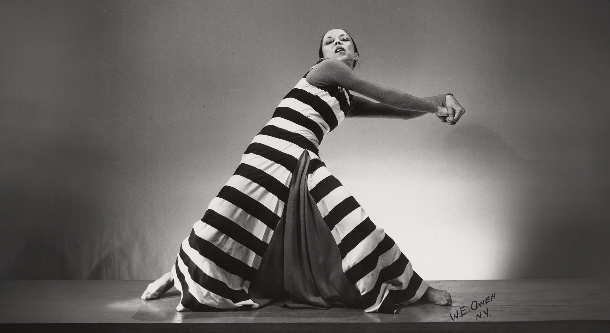 dancer in black and white striped dress