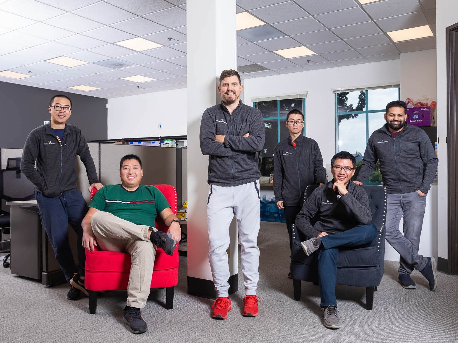 nexus group members posing in an office