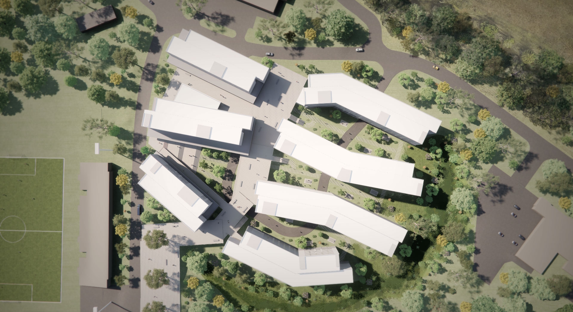 Aerial view six white buildings surrounded by trees