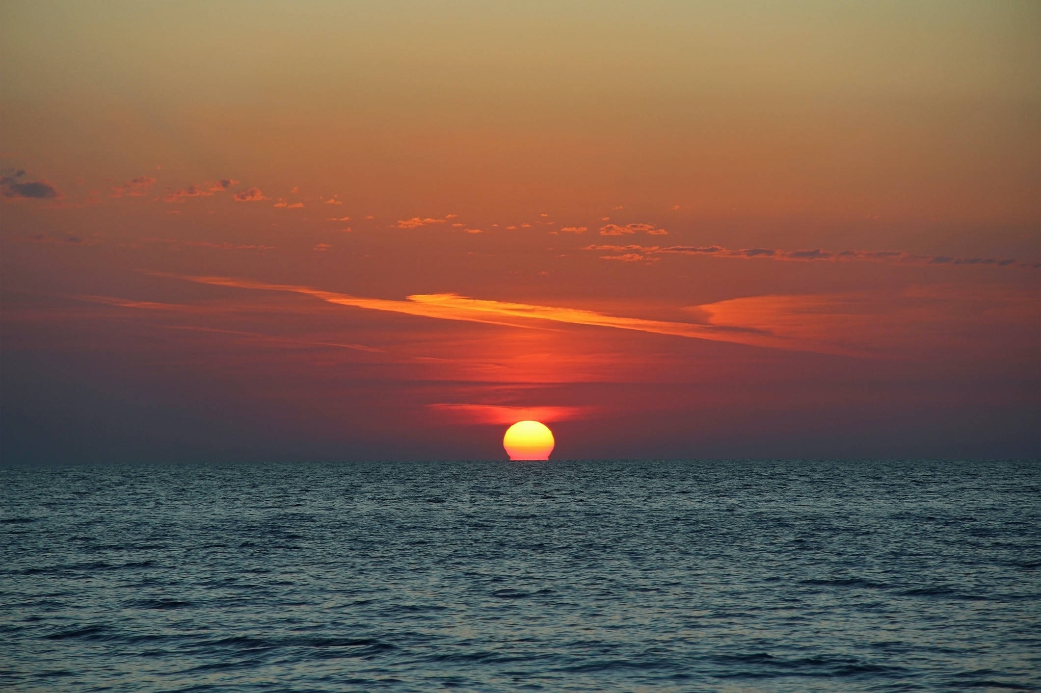 the sun sinks behind the horizon of the Black Sea