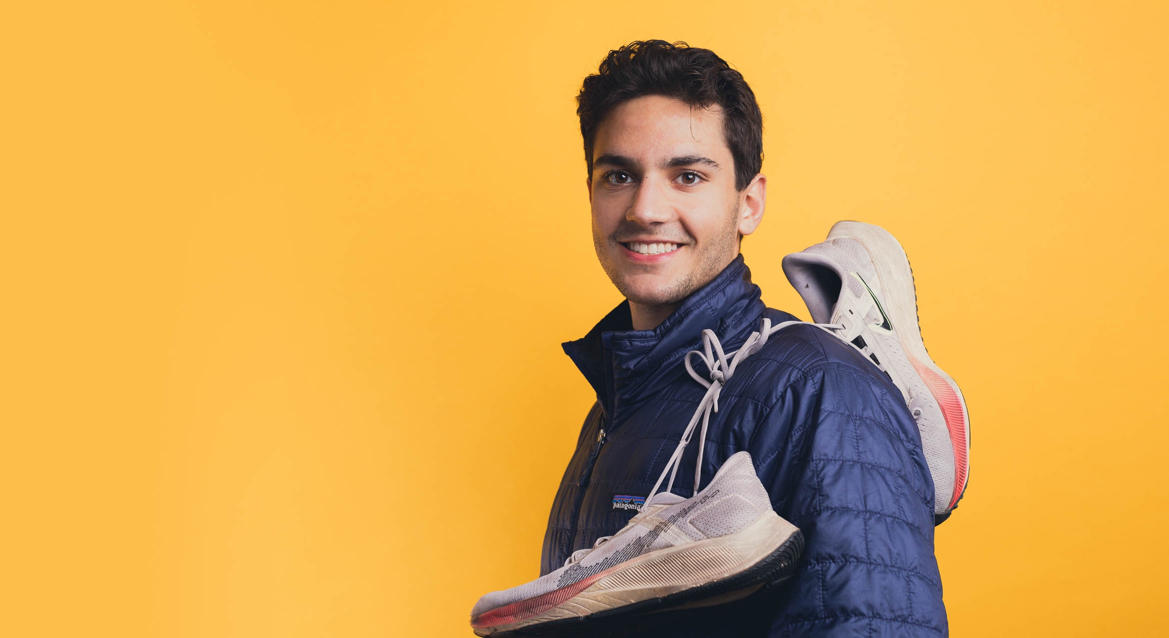 photograph of UCSB student Matthew Schoen with a pair of sneakers 