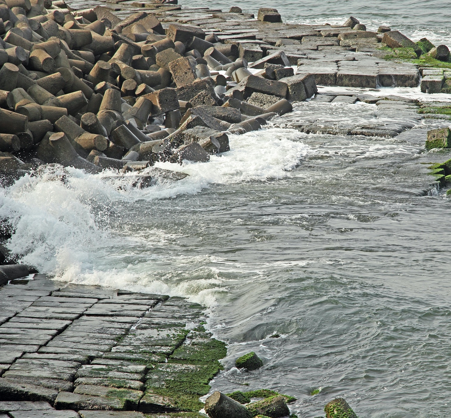 ocean eroding a seawall