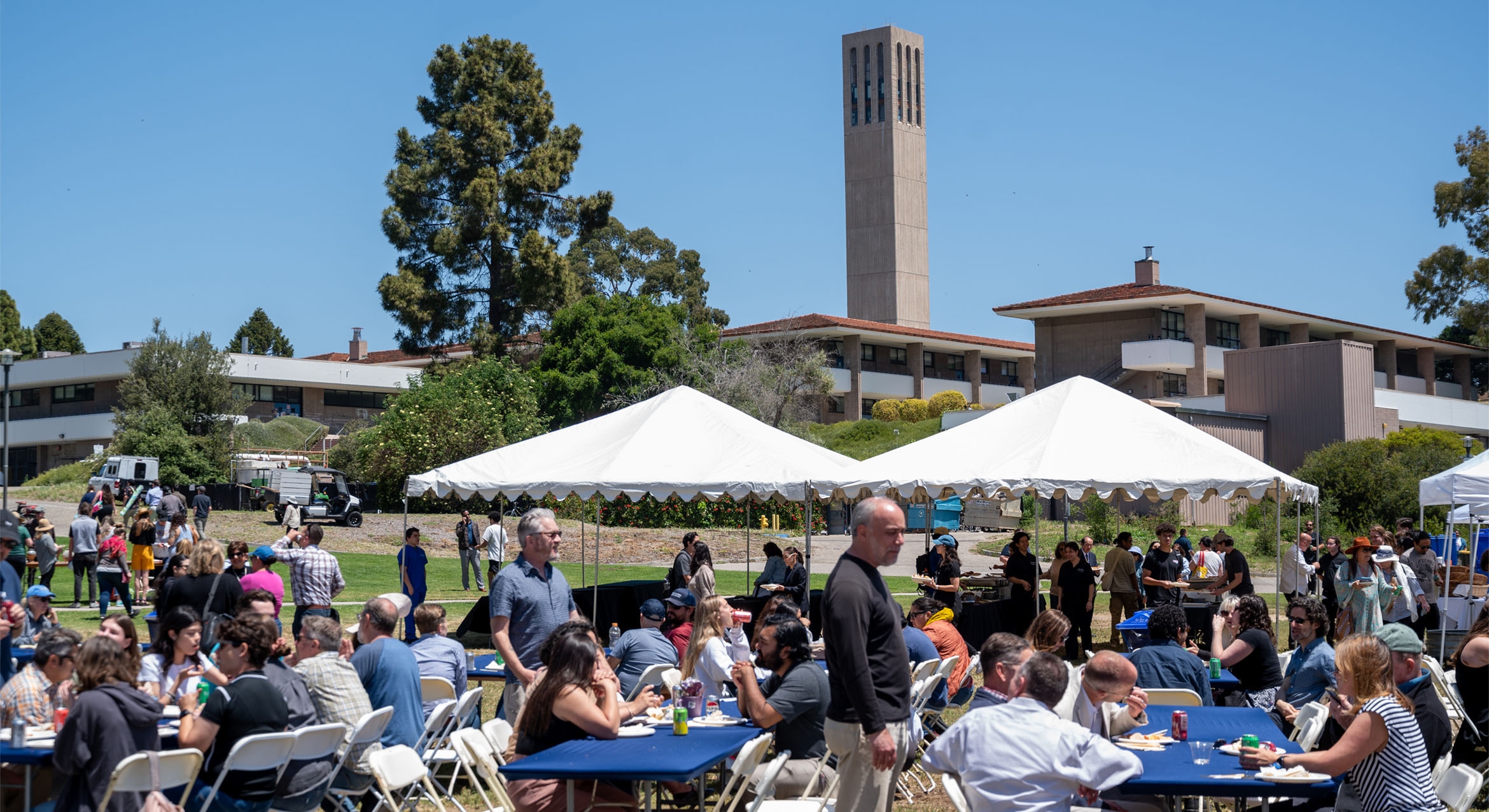 Staff luncheon on the Lagoon Green with Storke Tower in the background