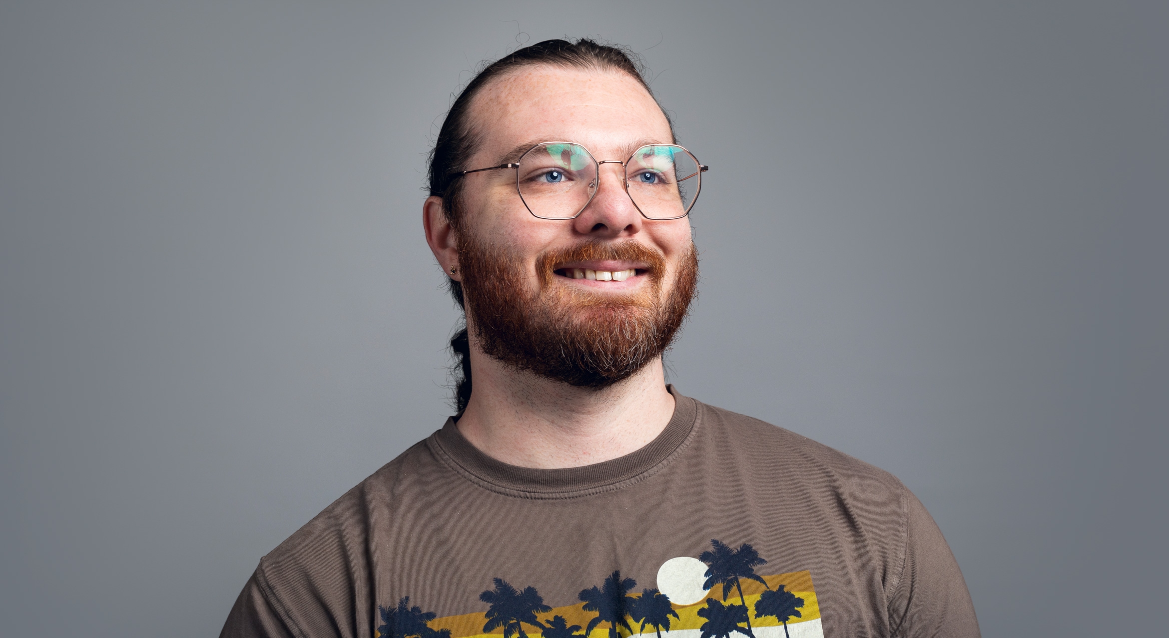 White man with beard and glasses smiling