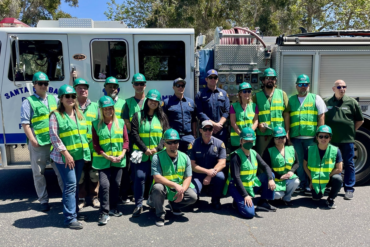 A group shot of the CERT trainees in front of a fire engine