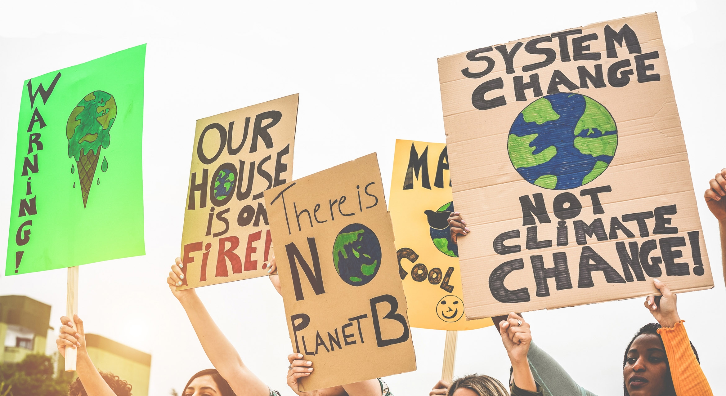 Concept photo showing protestors holding climate change signs