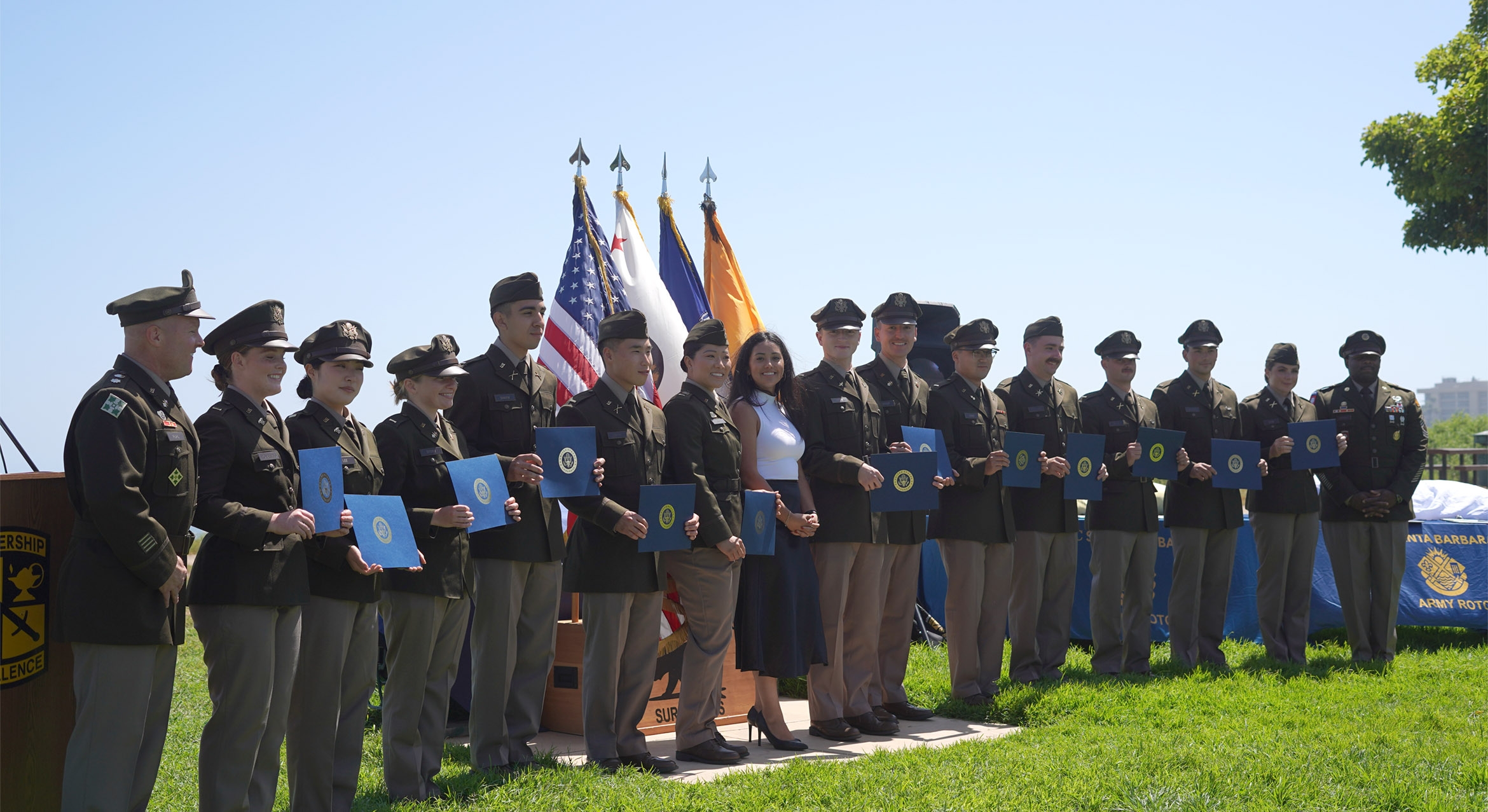 a color photograph group shot of 13 graduating cadets of UCSB's ROTC program