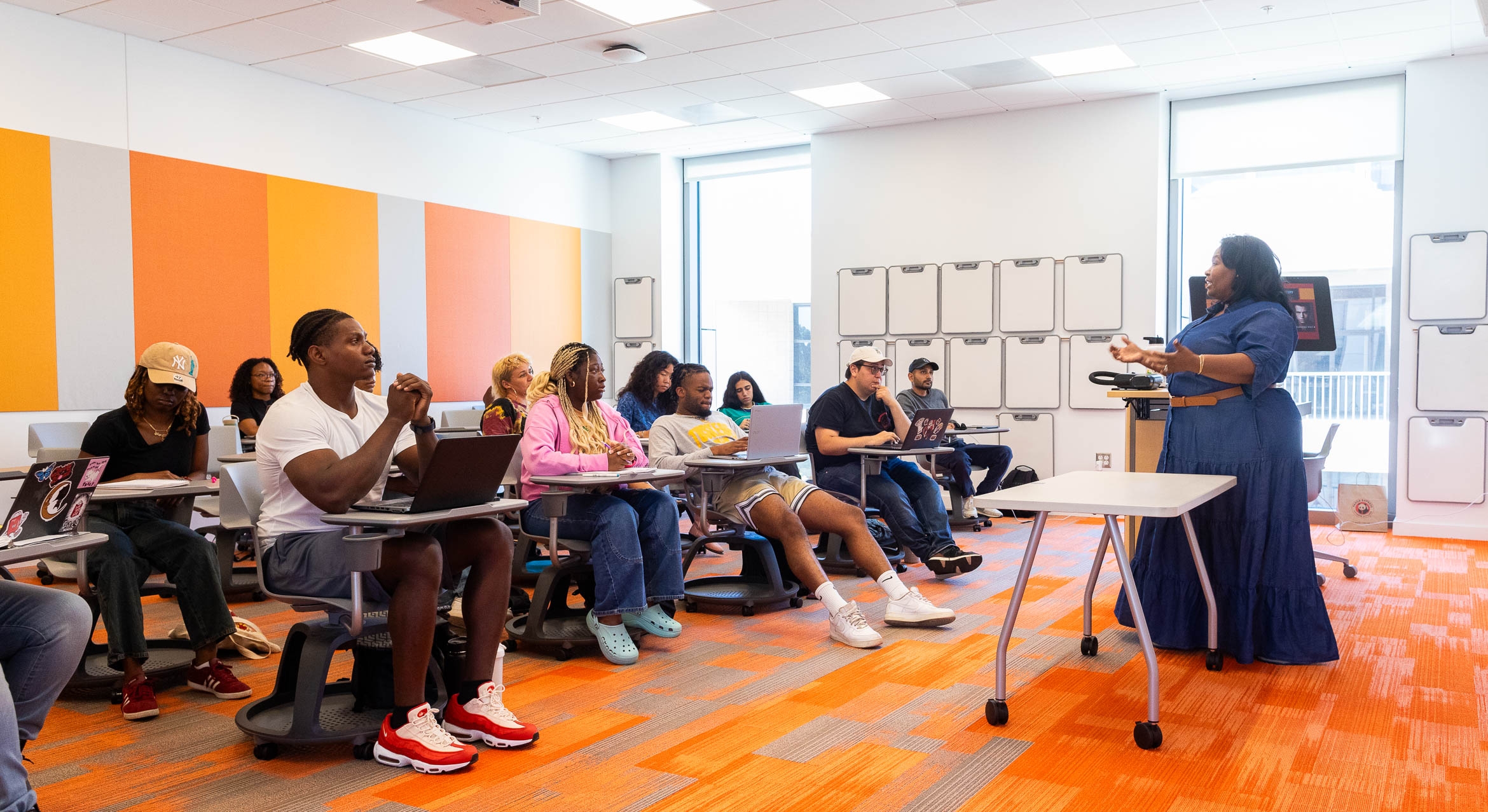 classroom with student of color and a Black professor