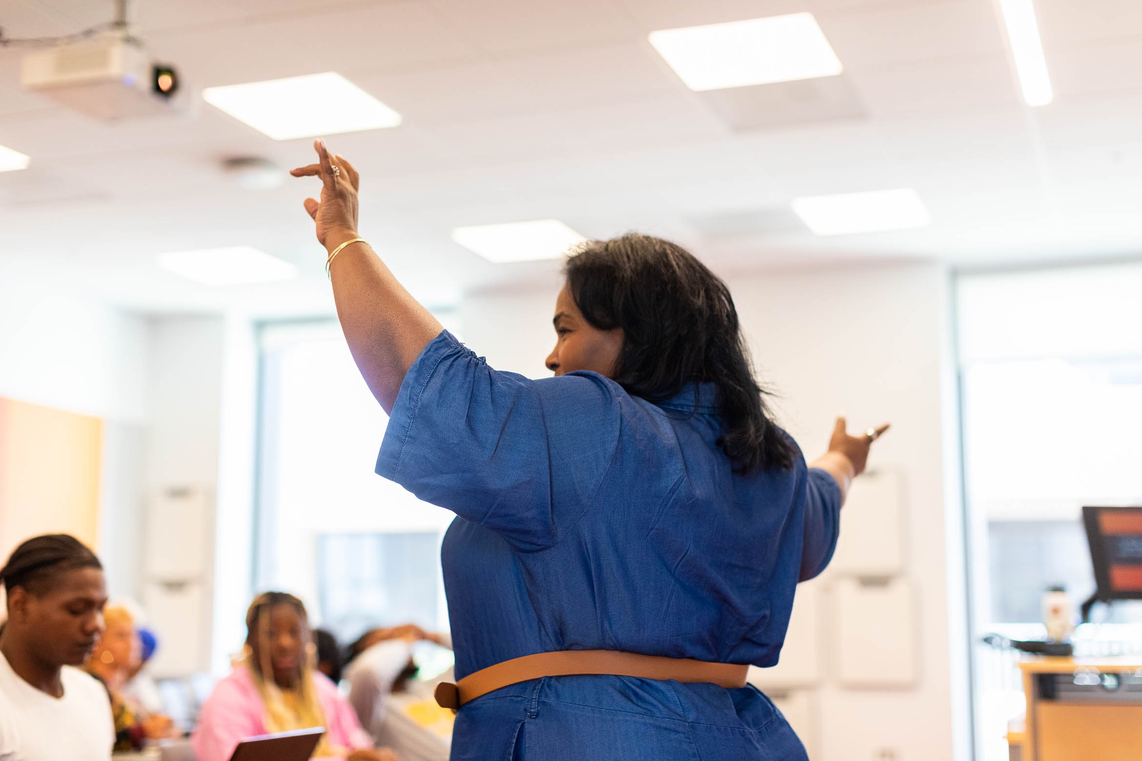 Black professor leads class with expressive composer like stance