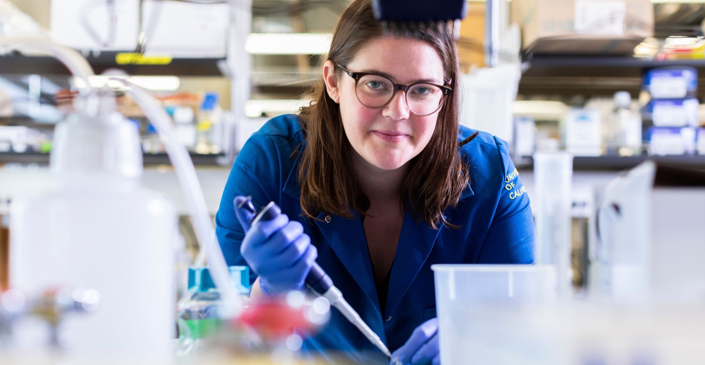 Meghan Morrissey uses a micropipette in her lab.