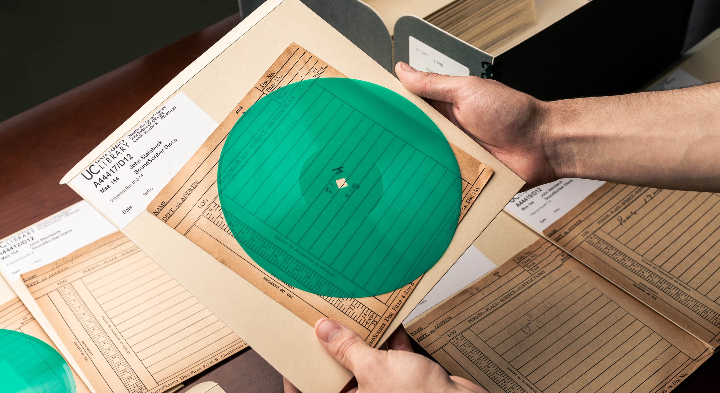 photograph of the green SoundScribe disc containing John Steinbeck audio recording 