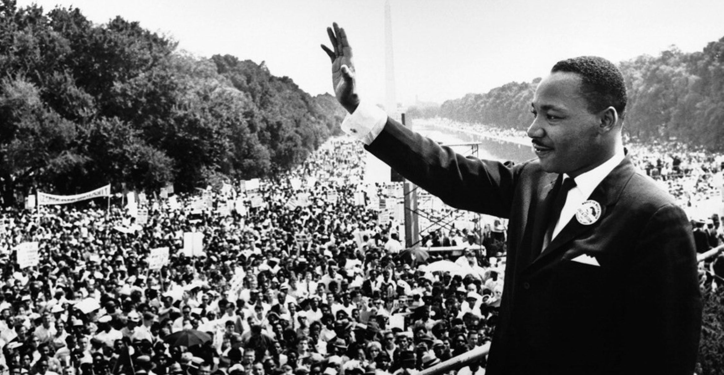 black and white photograph of Martin Luther King Jr. at the Lincoln Memorial