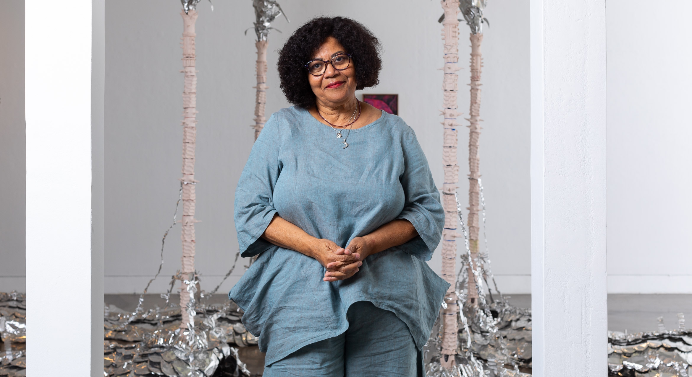 Black Studies professor in front of an art installation