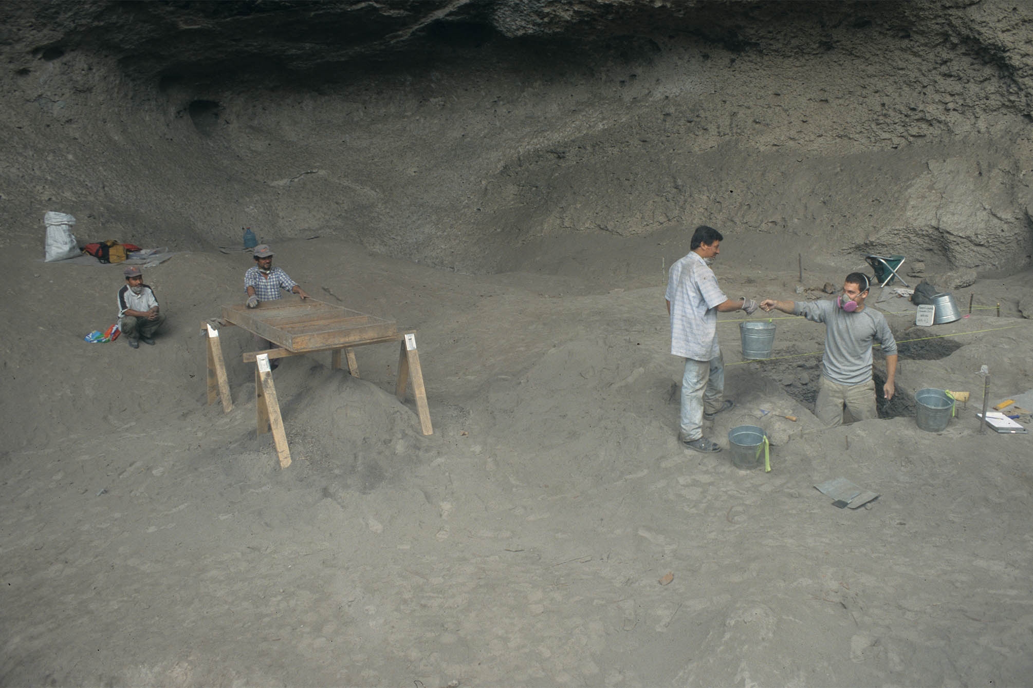 A group of people excavating a cave