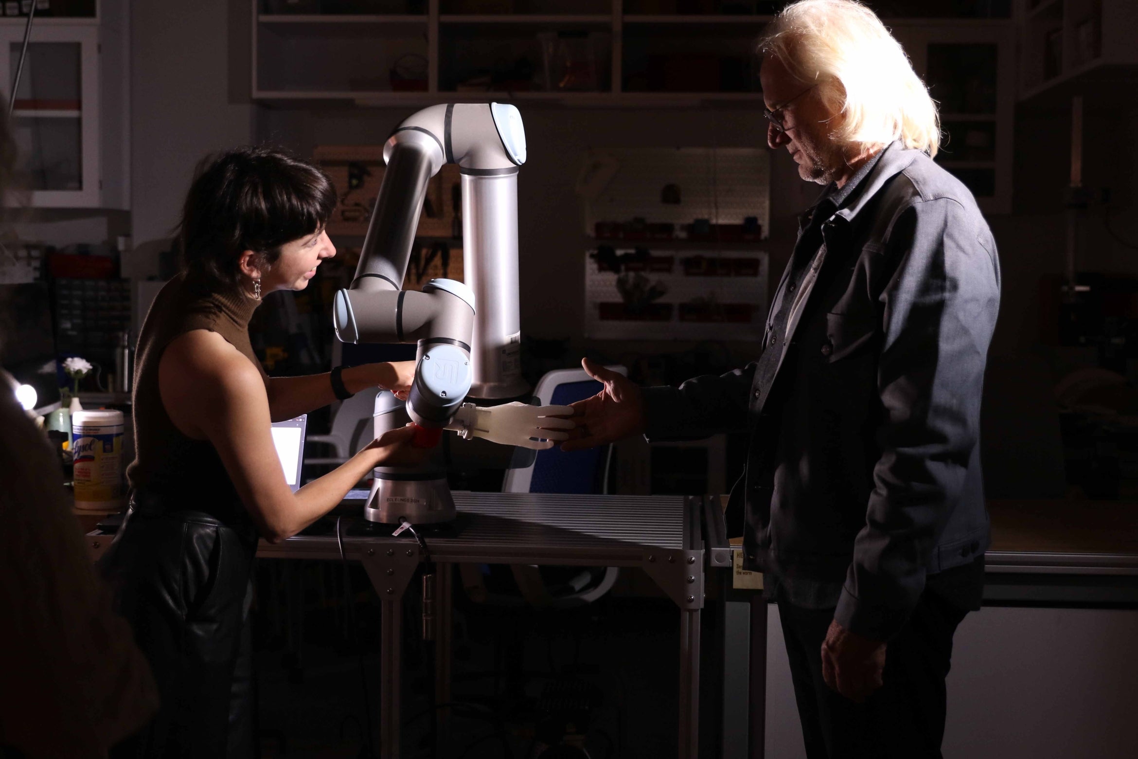 robotic arm and two people
