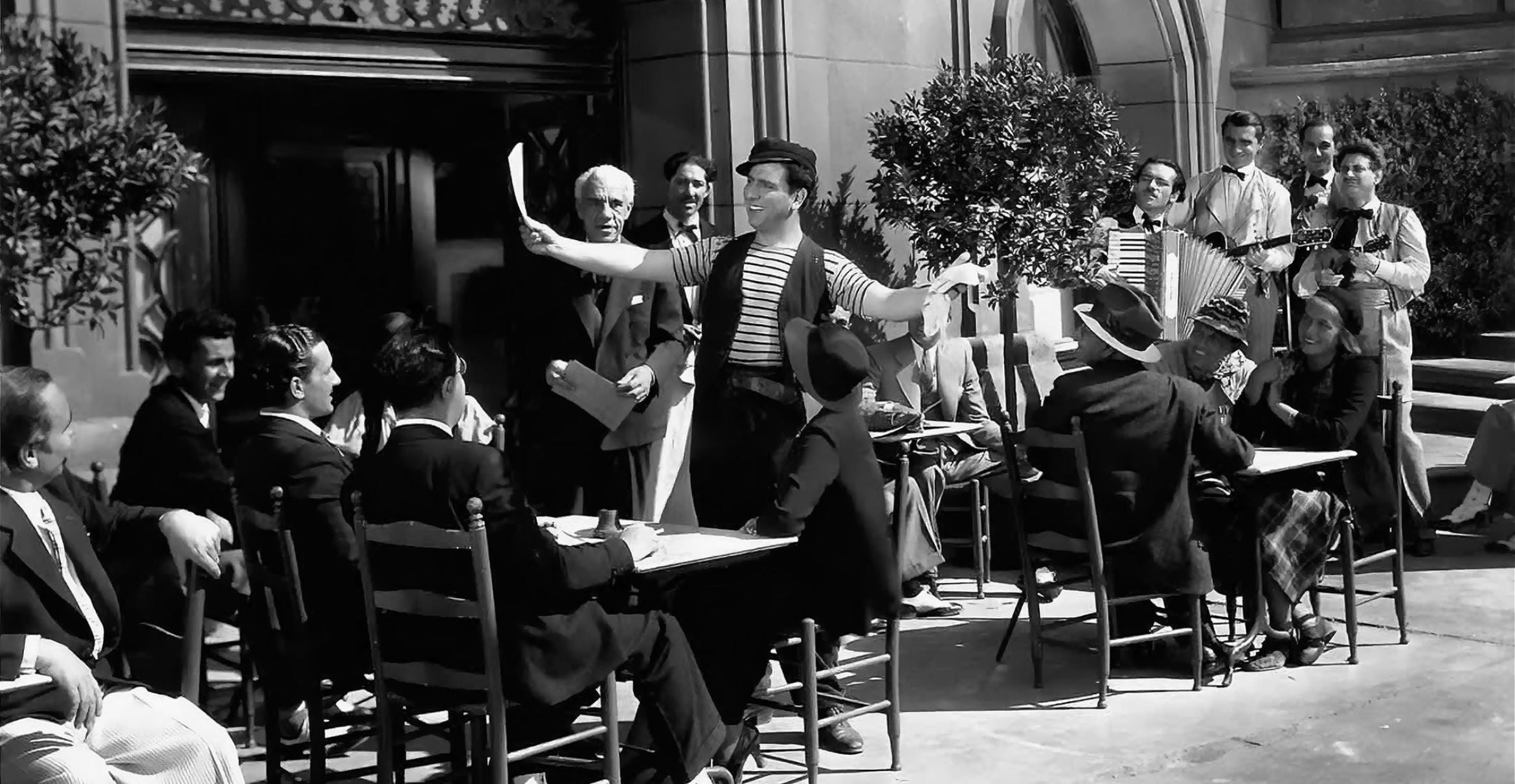 black and white photograph of Erico Caruso Jr. on the set of the musical film "El Cantante de Napoles"