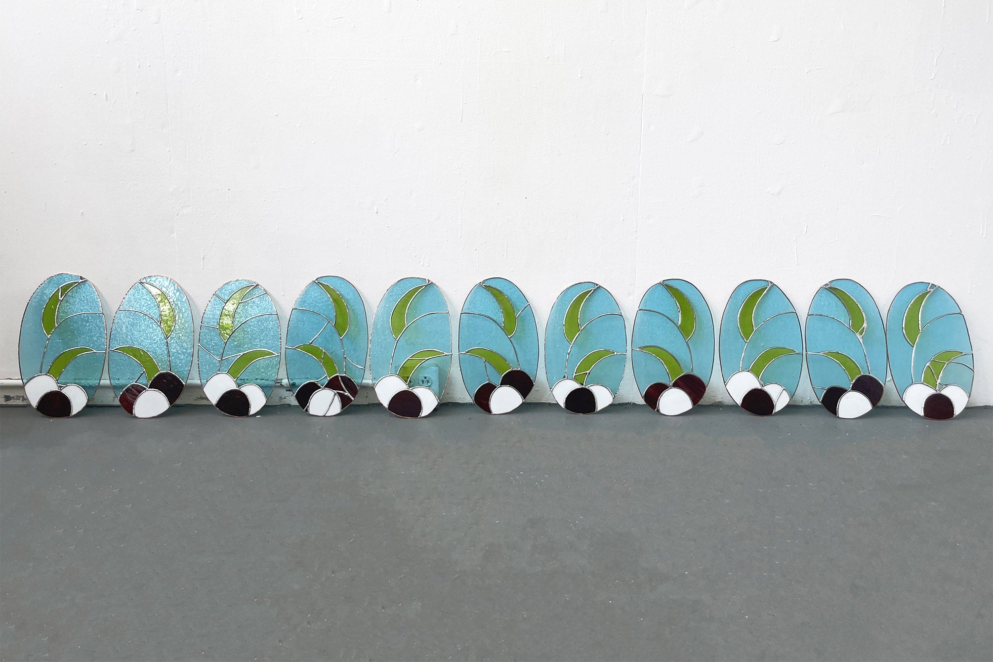Set of 12 stained Tiffany Today glass, lead, solder, copper panels