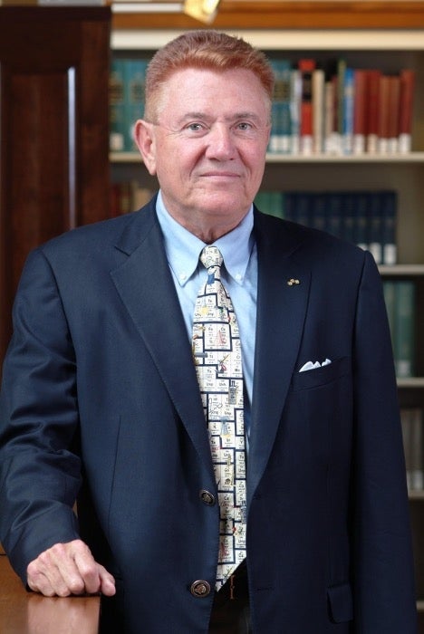 older white man in suit and tie