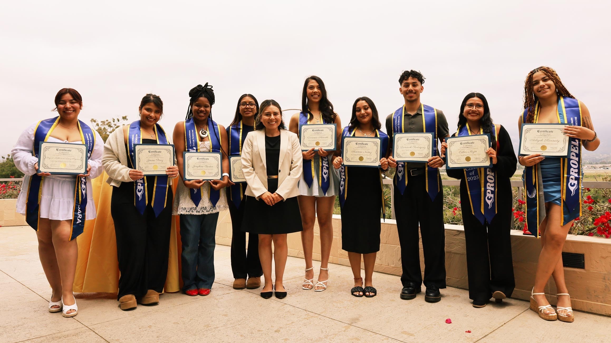 a group of students with certificates