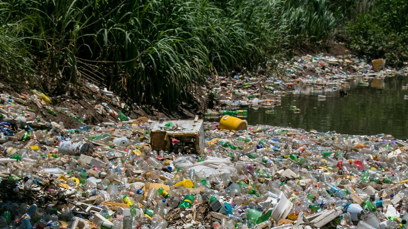 plastic trash in river bed