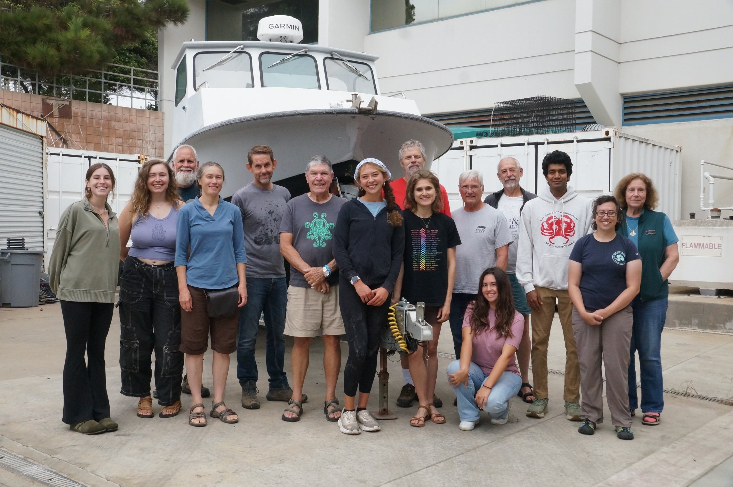 science team in front of boat
