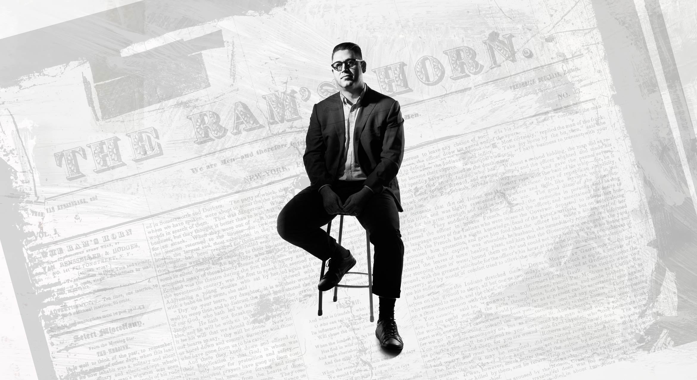 man sitting on chair with newspaper cover background