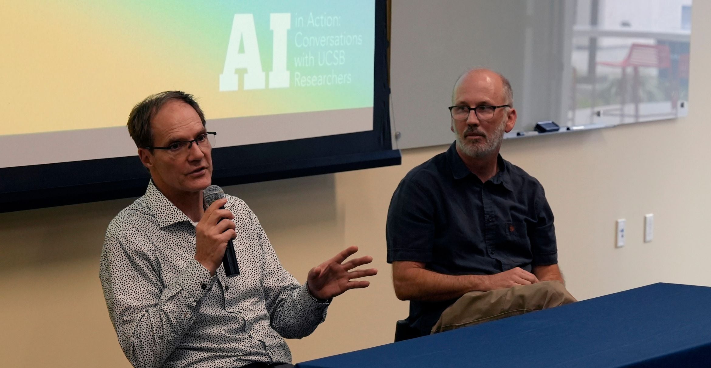 professors Tobias Fischer and Ben Halpern discuss AI in their research during a library speaker series 