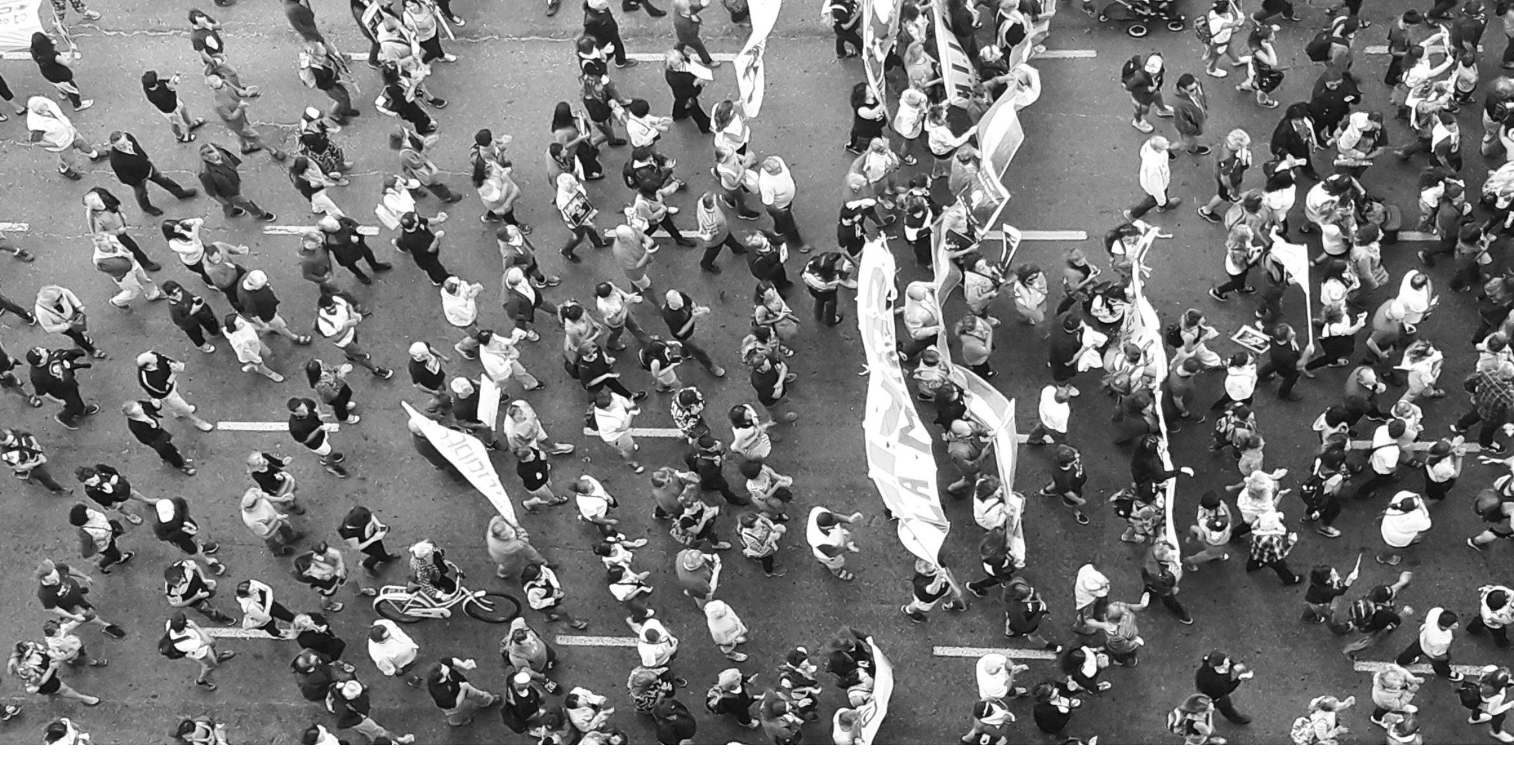 black and white overhead photograph of a peaceful protest march