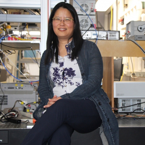 Songhi Han sits in her laboratory